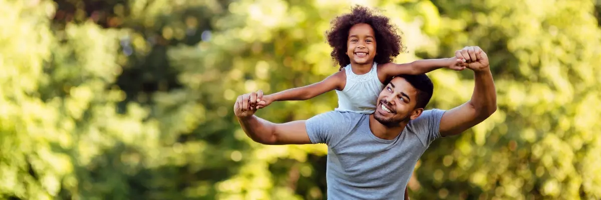 Goodman Ray Solicitors Representing Children Solicitors Cover Father And Daughter Having Fun In A Field