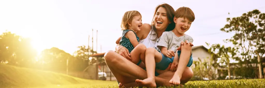 Goodman Ray Solicitors Representing Children Solicitors Cover Mather And Children Having Fun In A Field