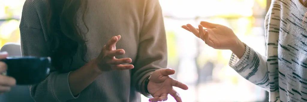 Who Pays for University Fees Following Separation and Divorce? - Picture of separated parents discussing who should pay university fees.