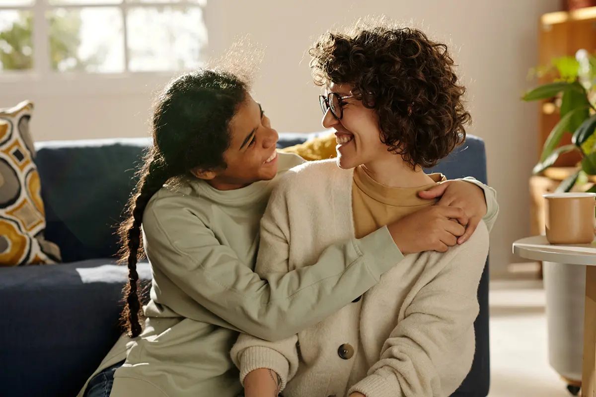 Foreign Adoption Orders - Picture of a parent and child cuddling.