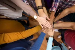 Goodman Ray Solicitors International Human Rights Day 2025 - Picture of hands coming together to show unity.