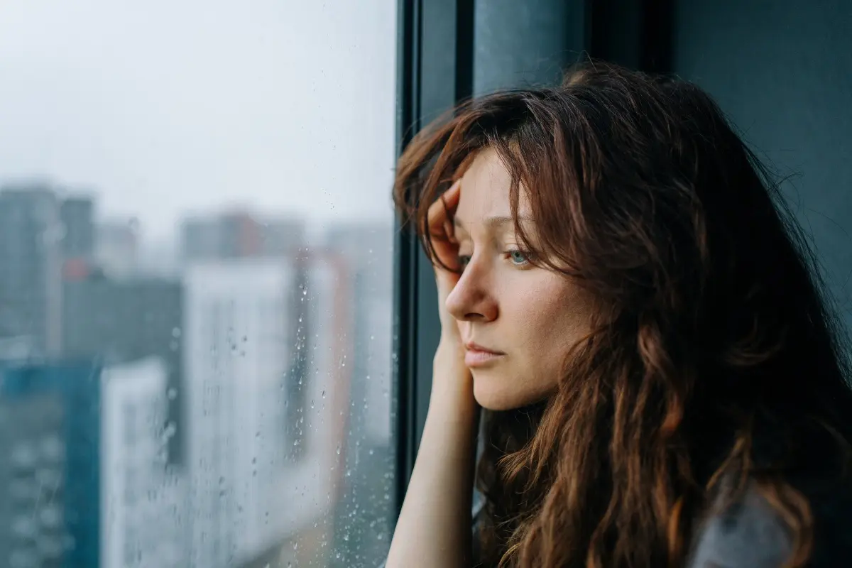 Goodman Ray Domestic Abuse Solicitors Non Molestation Order Solicitors Scared Woman Looking Out Of A Window Feature